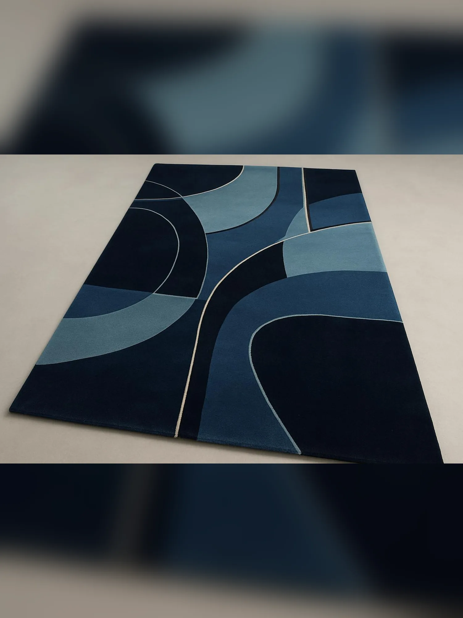 Neel carpet at an angle: navy, ocean and sky-blue arcs separated by fine ivory lines